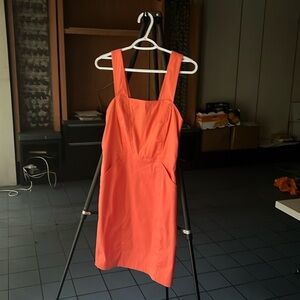 Bebe dress. Size 8. Form fitting. Melon orange. With pockets.